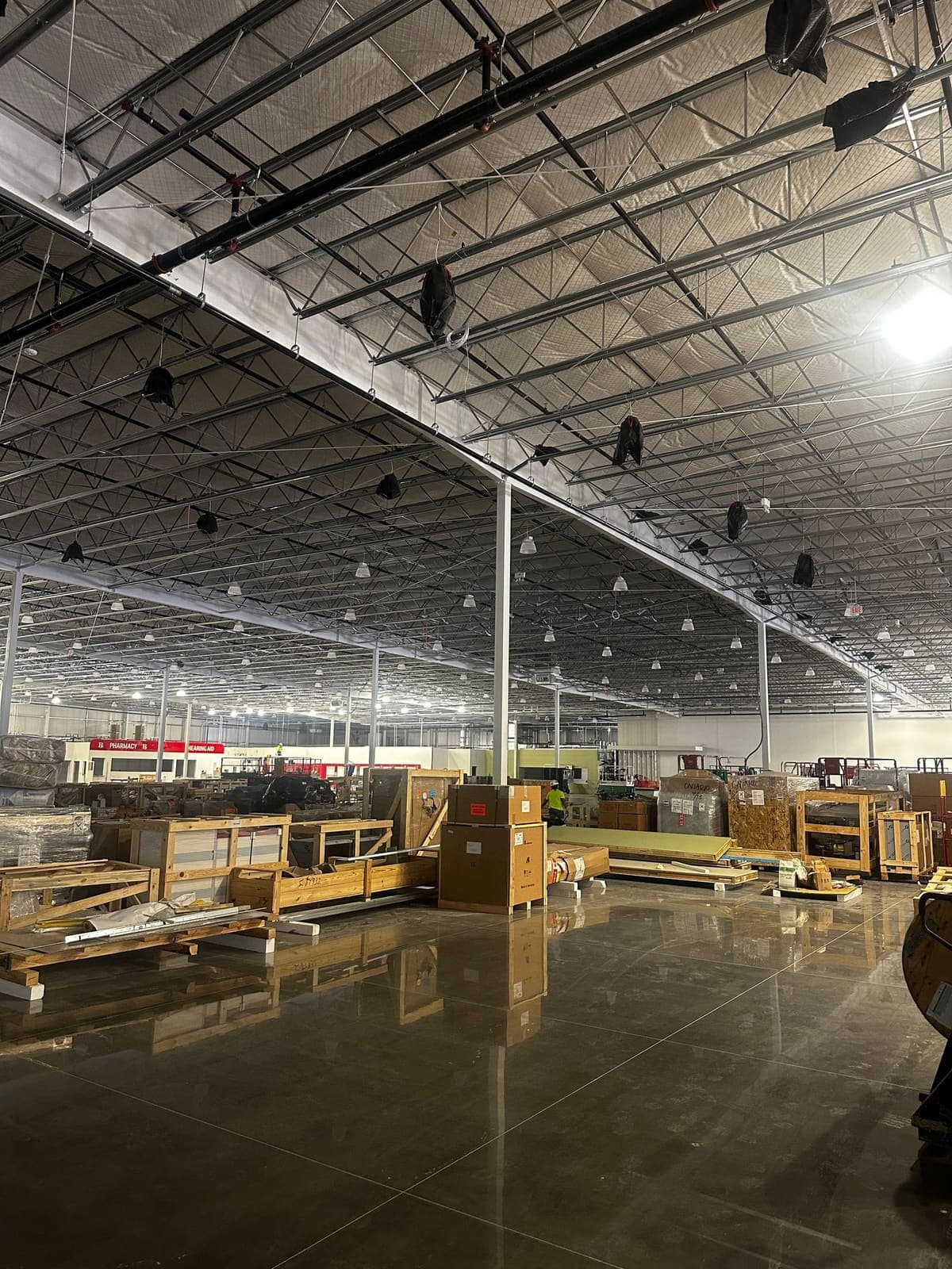 Large retail build mid construction, cleaning staged around trades