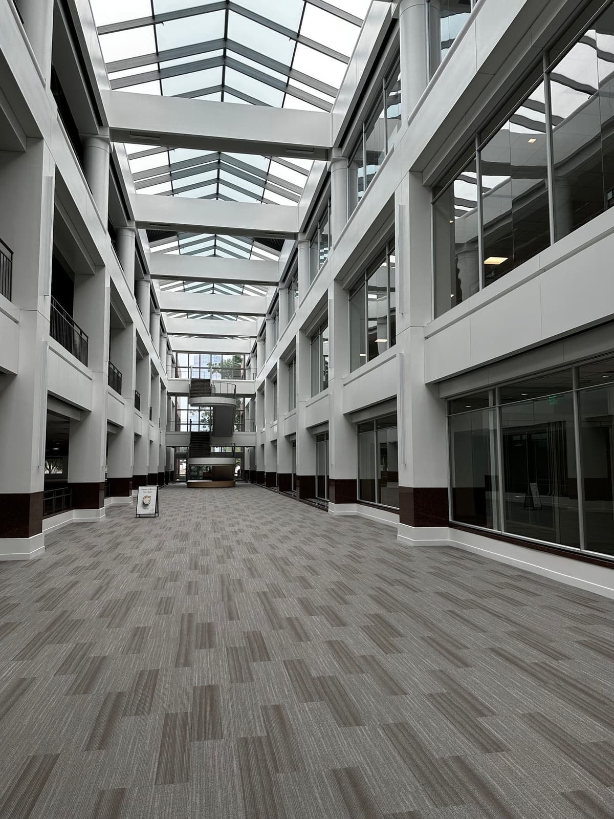 Walking a skylit commercial atrium during a BLU Audit